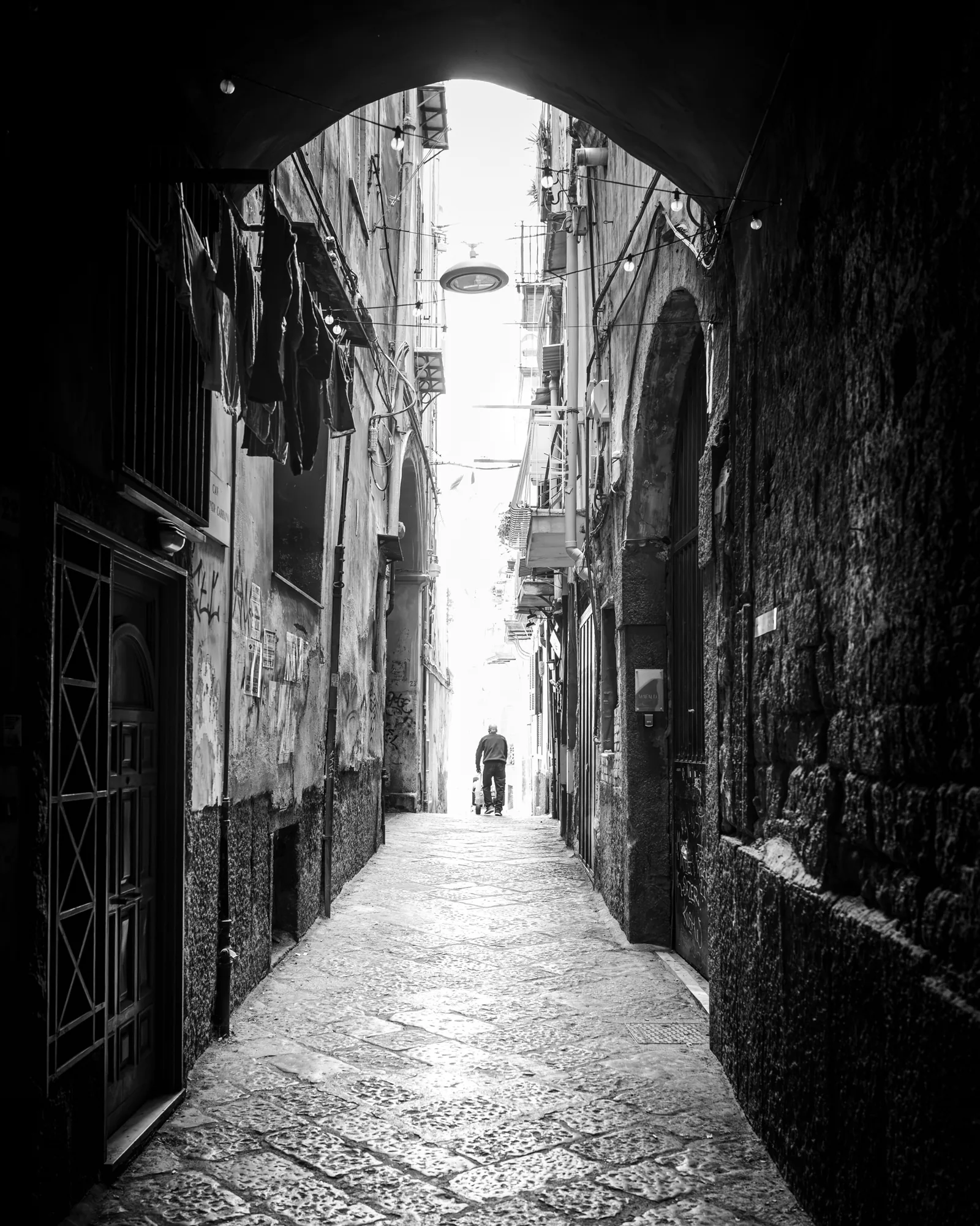 Narrow alley, lone figure
